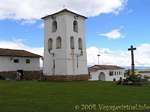 Bell tower and cross isolated from Iglesia Colonial Chinchero, Peru.