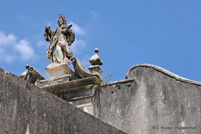 Statue on top of the building of the University, Coimbra - Portugal