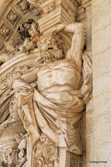 Atlas carved at the entrance of the University of Coimbra - Portugal