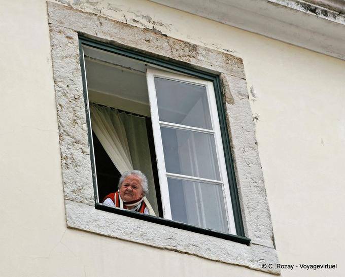 The curious grandma at her window, Alfama, Lisbon - Portugal