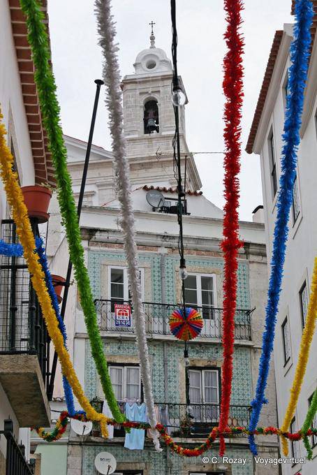 Festive preparations and tower of São Estêvão, Alfama, Lisbon - Portugal