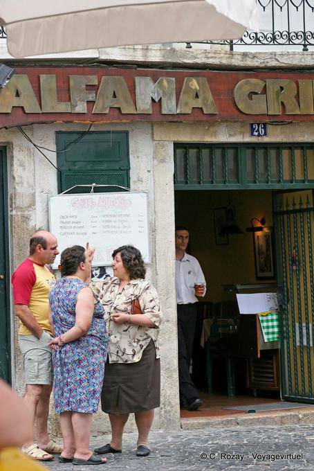 Discussion on the streets of São Miguel, Alfama, Lisbon - Portugal