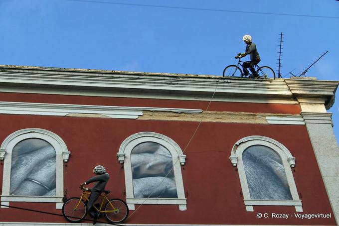 Cyclists on the roof, street Misercordia, Chiado, Lisbon - Portugal