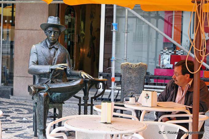 Fernando Pessoa statue on the terrace of Brasileira, Chiado, Lisbon - Portugal