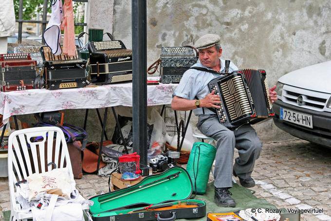 Graça, an accordionist market Santa Clara, Lisbon - Portugal