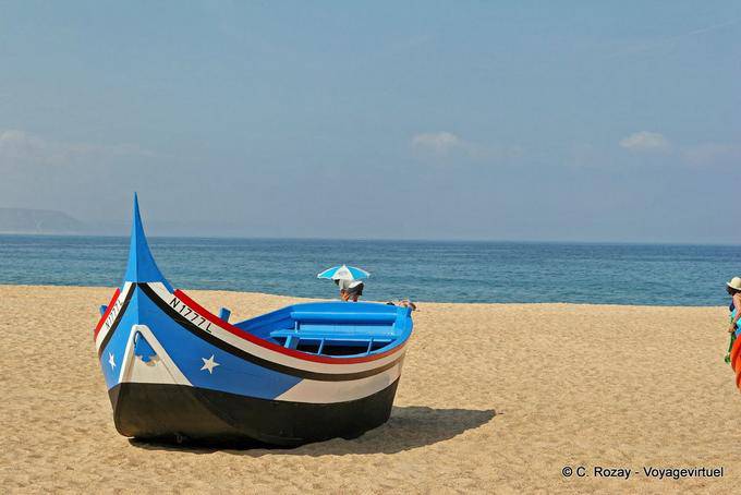 A typical boat on the beach of Nazaré - Portugal
