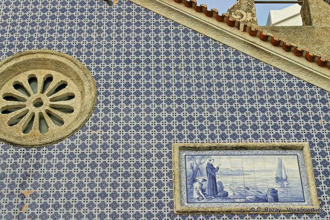 The table and ceramic tiles on the chapel beginning of the Avenue of the Republic, Nazaré - Portugal
