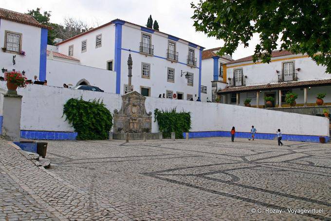 The fountain and the pillory on the Piazza Santa Maria, Obidos - Portugal