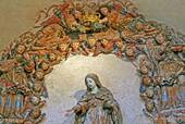 Colored angels around the virgin, the top of the altar representing the death of Saint Bernard, Alcobaça, Portugal.