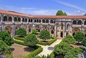 View of the cloister and garden, Alcobaça Monastery, Portugal.