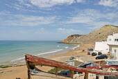 Burgau beach and old boats, Algarve, Portugal.