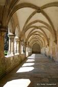 The arches of the walkway, cloister Alfonso V, Batalha, Portugal.