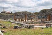 Columns of the singing house (Casa de Cantaber) and perimeter wall, Conimbriga, Portugal.