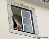 The curious grandma at her window, Alfama, Lisbon, Portugal.