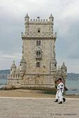Sailors past Belém Tower, north face, Lisbon, Portugal.