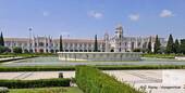 Panorama from the garden pond, back Jerónimos Monastery, Lisbon, Portugal.