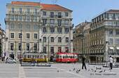 Trams yellow and red, Rossio, Lisbon, Portugal.