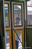 Behind the door of the tram, Lisbon, Portugal.