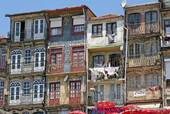 The facades of typical houses Cais da Estiva, Porto, Portugal.