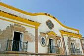 Balconies on decrepit facade, Tavira, Portugal.