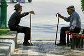 The two rods, discussion of old, Tavira, Portugal.