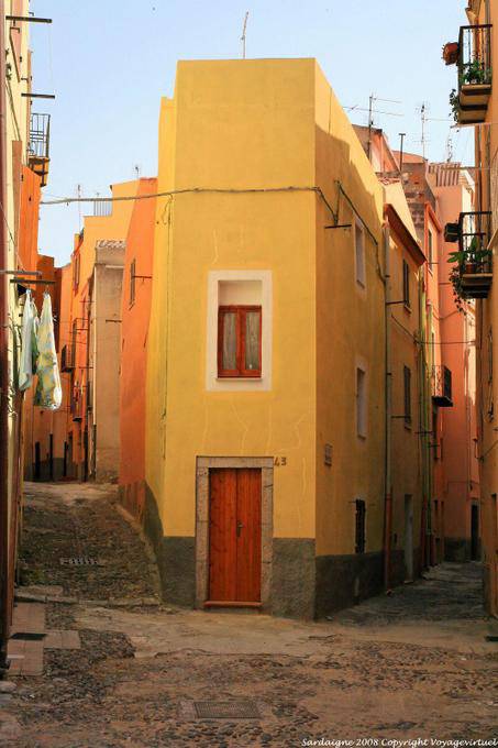 Bosa, narrow house in street corner - Sardinia