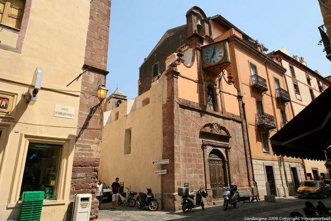 Bosa, Corso Vittorio Emanuele II, stepped clock on the facade of a church - Sardinia