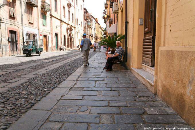 Bosa, Corso Vittorio Emanuele II, the elders and the cobbles - Sardinia