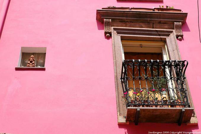 Bosa, Vicolo della Scuda, balcony purple facade - Sardinia