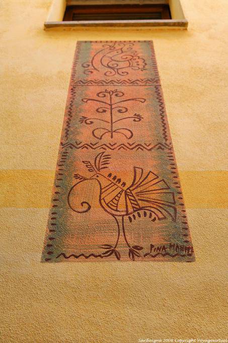 Bosa, Vicolo della Scuda, motifs painted on a front wall - Sardinia