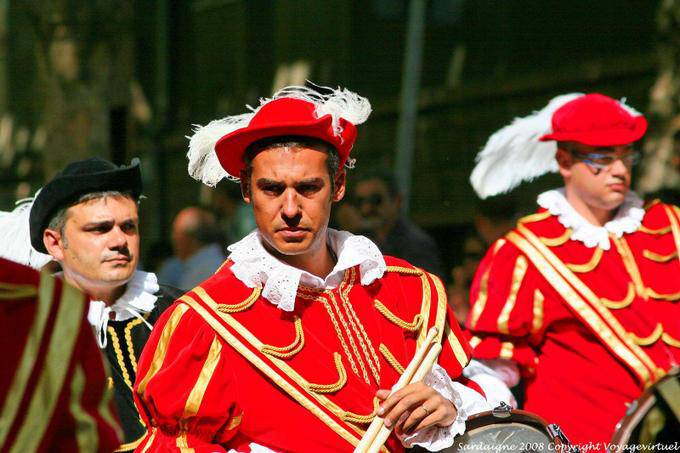 Nuoro, Festa del Redentore, musician red suit - Sardinia