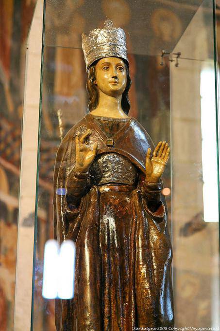Basilica della Santissima Trinita di Saccargia, wooden statue of saint in a glass box - Sardinia