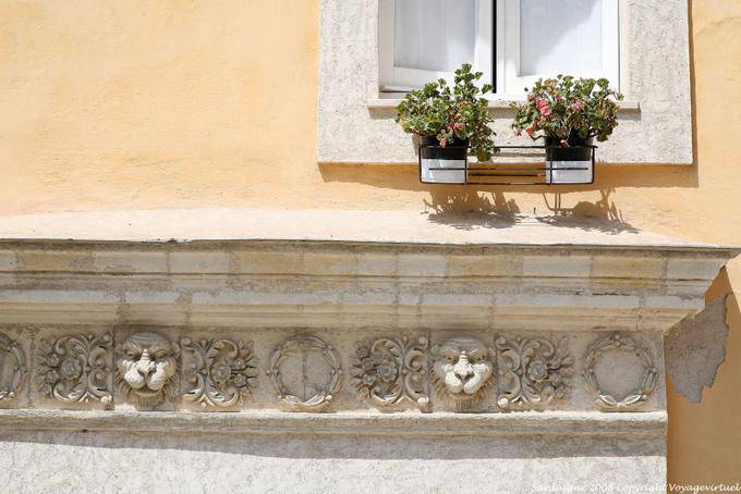 Sassari, carved lion heads via Decimario - Sardinia