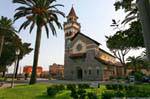 The bell tower and facade of the parish church of Christ the Redeemer, Arborea, Sardinia.