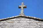 Luras, granite cross on the church of the Rosary, Sardinia.