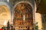Basilica of the Holy Trinity of Saccargia, general view of the apse and frescoes, Sardinia.