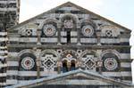 Basilica della Santissima Trinita di Saccargia, zoom on decorating the top of the facade, Sardinia.