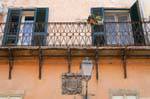 Sassari, Piazza Tola, a coat of arms under a balcony, Sardinia.