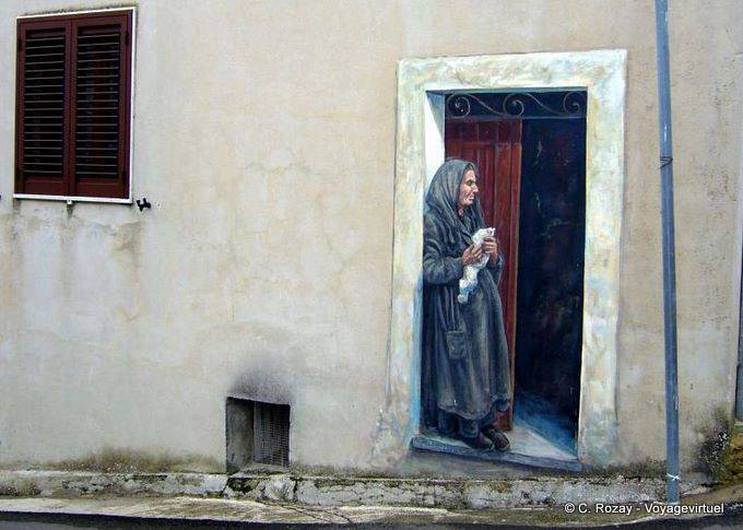 The old woman at the door, murals Cossoine - Sardinia