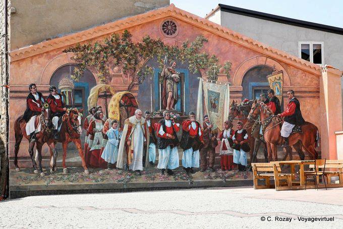 Fonni, Piazza Parrocchia, religious procession scene, murals - Sardinia