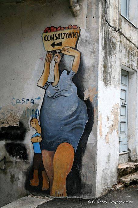 Orgosolo, Consultorio, indication at the corner of Corso Repubblica, murals - Sardinia
