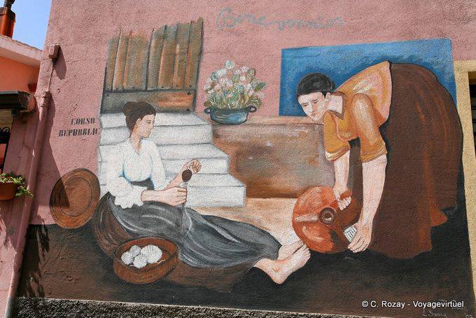 Orgosolo, the spinner and the water carrier, Corso Repubblica, murals - Sardinia
