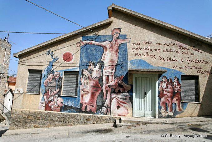 Orgosolo, Deus Bonu, mural on the facade of a house - Sardinia