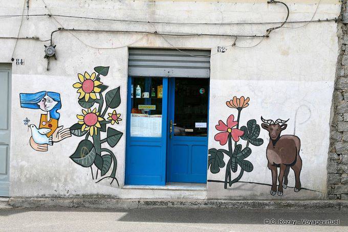 Orgosolo, paint on the facade of the modern grocery store - Sardinia
