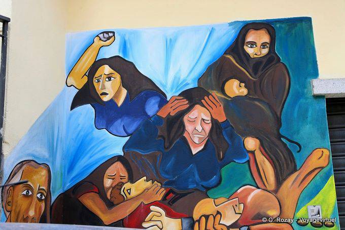 Orgosolo, detail of the facade of the Town Library, Dante - Sardinia