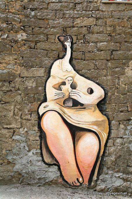 Orgosolo, a mother and her child, artist vision, murals - Sardinia
