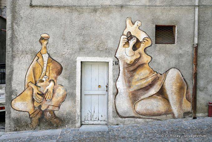 Orgosolo, family history, mural on facade, Via Alcide De Gasperi - Sardinia