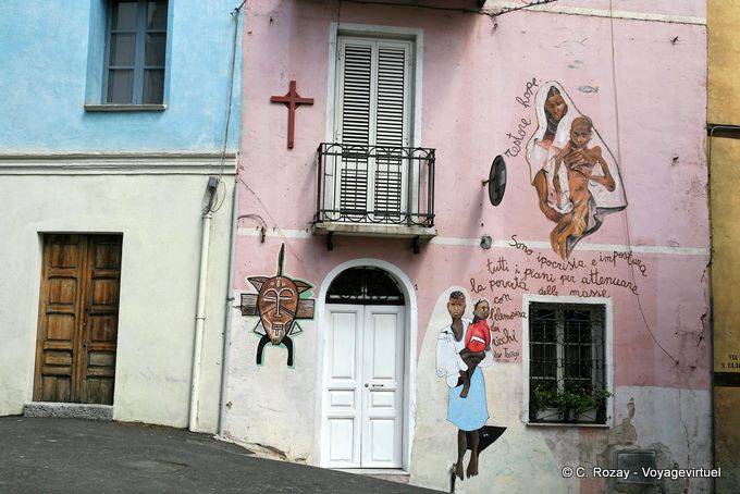 Orgosolo, hypocrisy and deception of the rich to poverty, murals - Sardinia