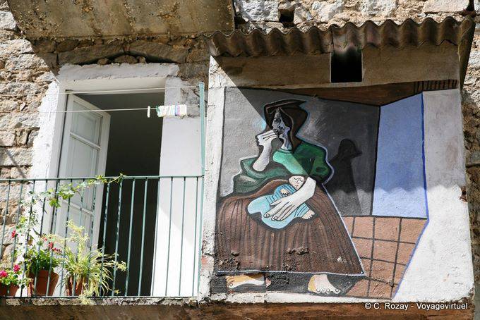 Orgosolo, play of shadows on the wall, murals - Sardinia