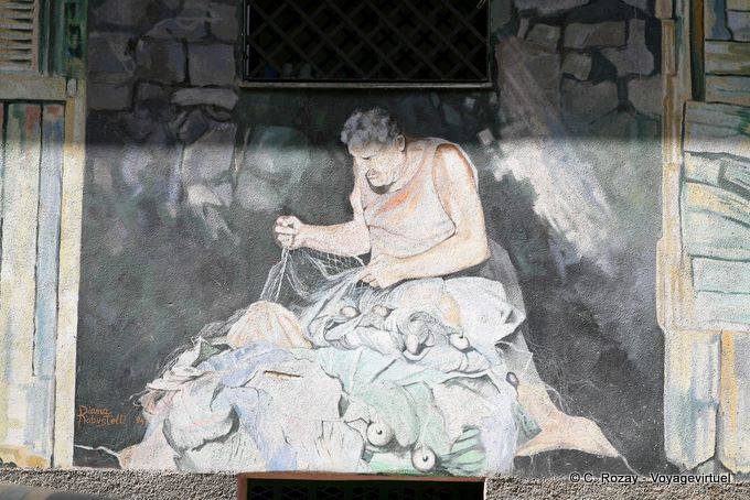 Orgosolo, the fisherman and his net, murals - Sardinia